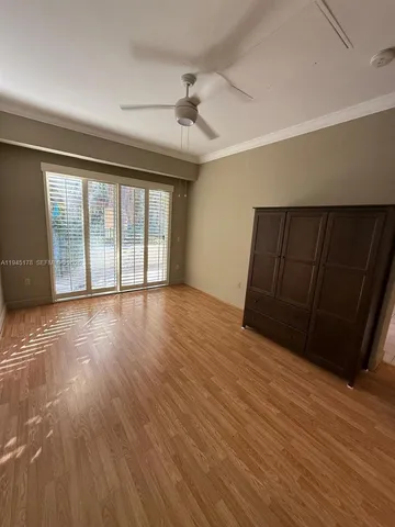 a view of a swimming pool with a lawn chairs and a fire pit