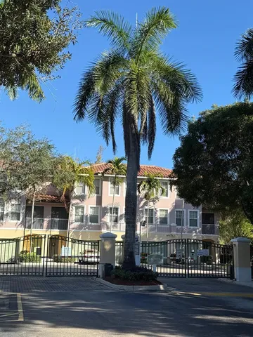 a view of a building with a palm tree