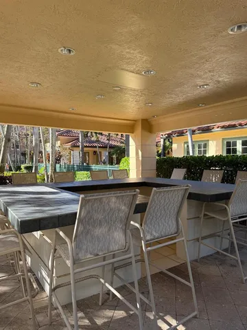 a view of a yard with palm trees