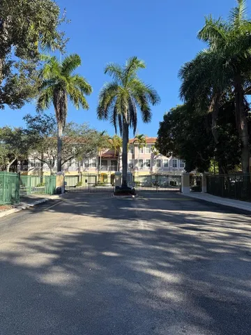 a view of street with palm trees