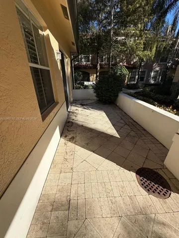a view of a livingroom with lounge chair and a window