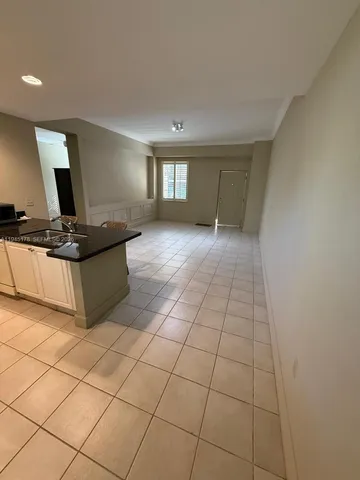 a kitchen with stainless steel appliances a sink and cabinets