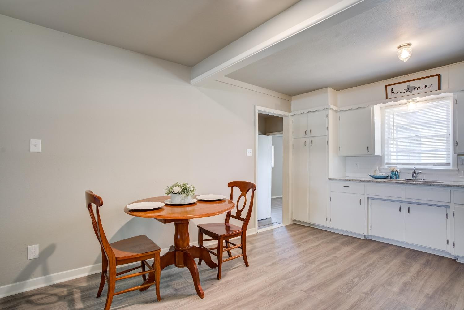 4629 Elgin Avenue Lubbock, TX 79413 - Photo 11 of 34 a view of a dining room with furniture and window