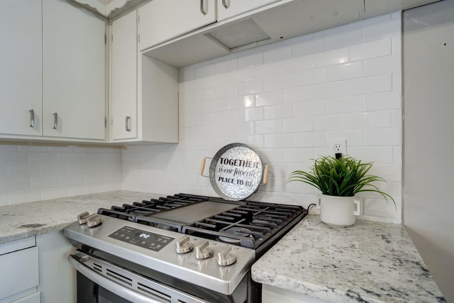 4629 Elgin Avenue Lubbock, TX 79413 - Photo 14 of 34 a view of kitchen island with stove