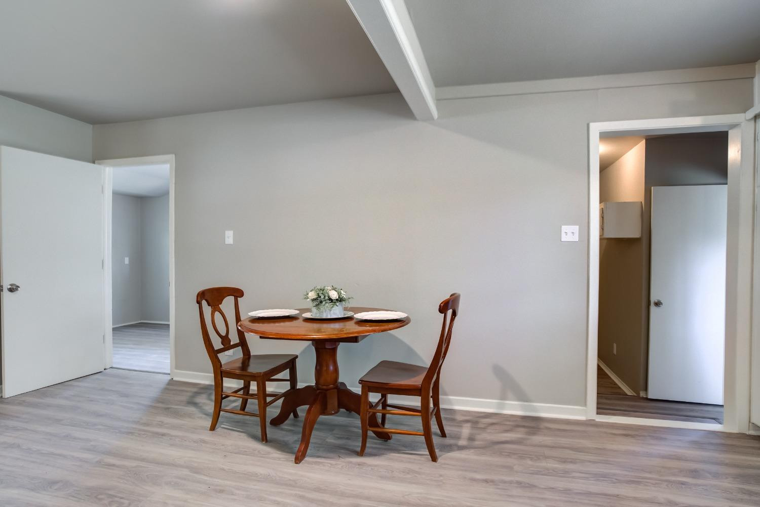 4629 Elgin Avenue Lubbock, TX 79413 - Photo 16 of 34 a dining room with furniture and wooden floor