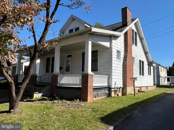 a view of house with yard