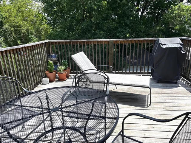 a view of balcony with wooden floor