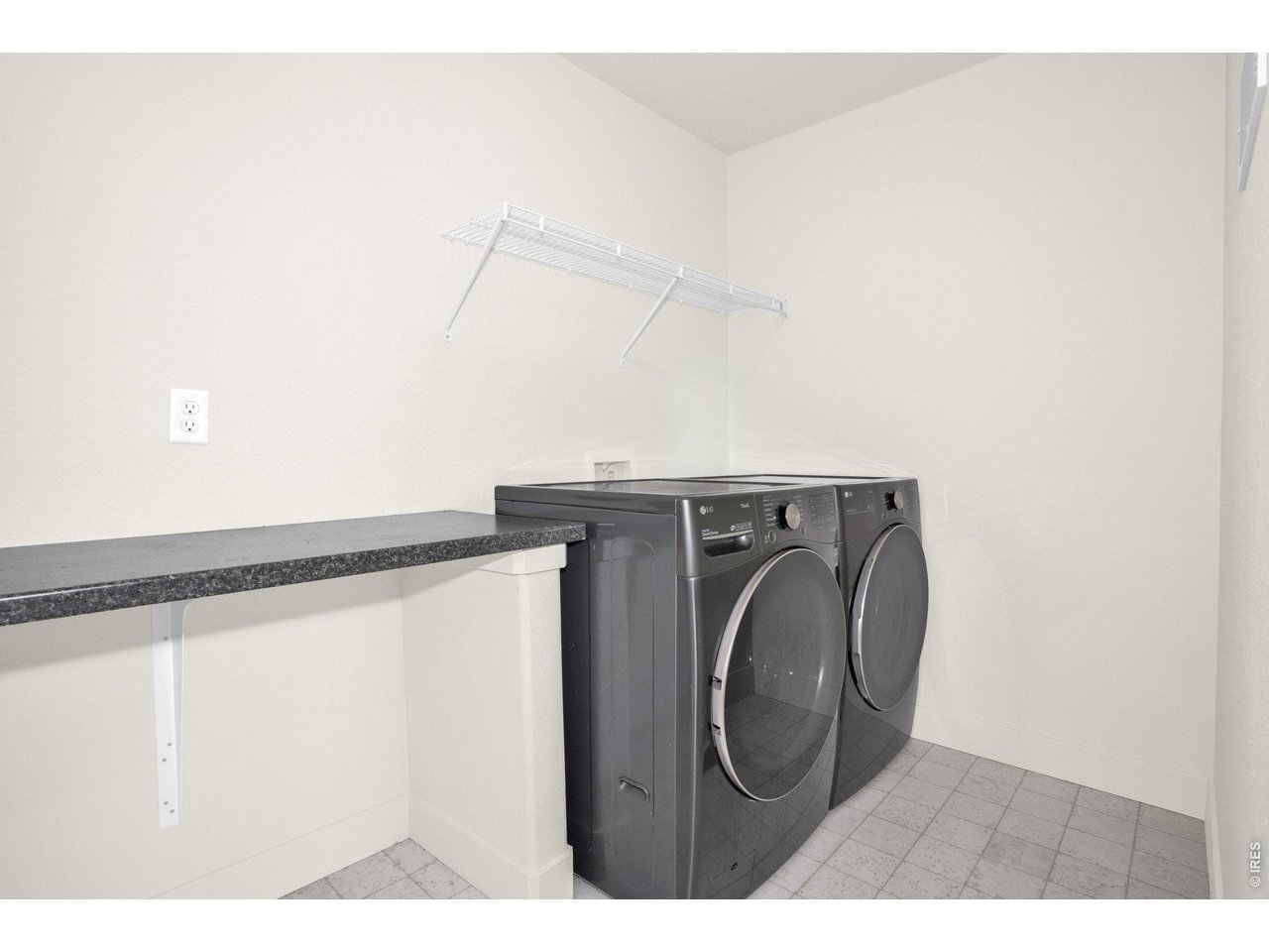 934 Milner Pass Road Severance, CO 80550 - Photo 15 of 33 Main floor laundry is conviently located just outside the primary suite!
