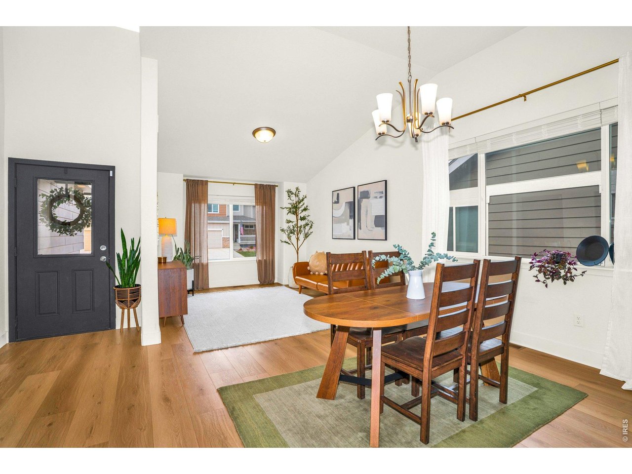 934 Milner Pass Road Severance, CO 80550 - Photo 2 of 33 Step into an inviting, open foyer where soaring vaulted ceilings and white crisp walls create an immediate sense of space and light.