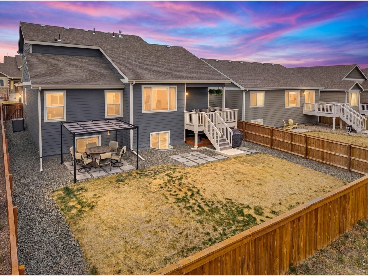 934 Milner Pass Road Severance, CO 80550 - Photo 27 of 35 The lower patio is optimal for additional outdoor seating during gatherings and fully fenced in backyard brings privacy and security.