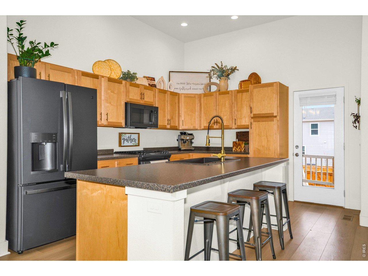 934 Milner Pass Road Severance, CO 80550 - Photo 6 of 33 The kitchen is a true centerpiece, featuring a sleek new undermount sink, brushed black granite appliances and a gas stove that will delight any home chef.