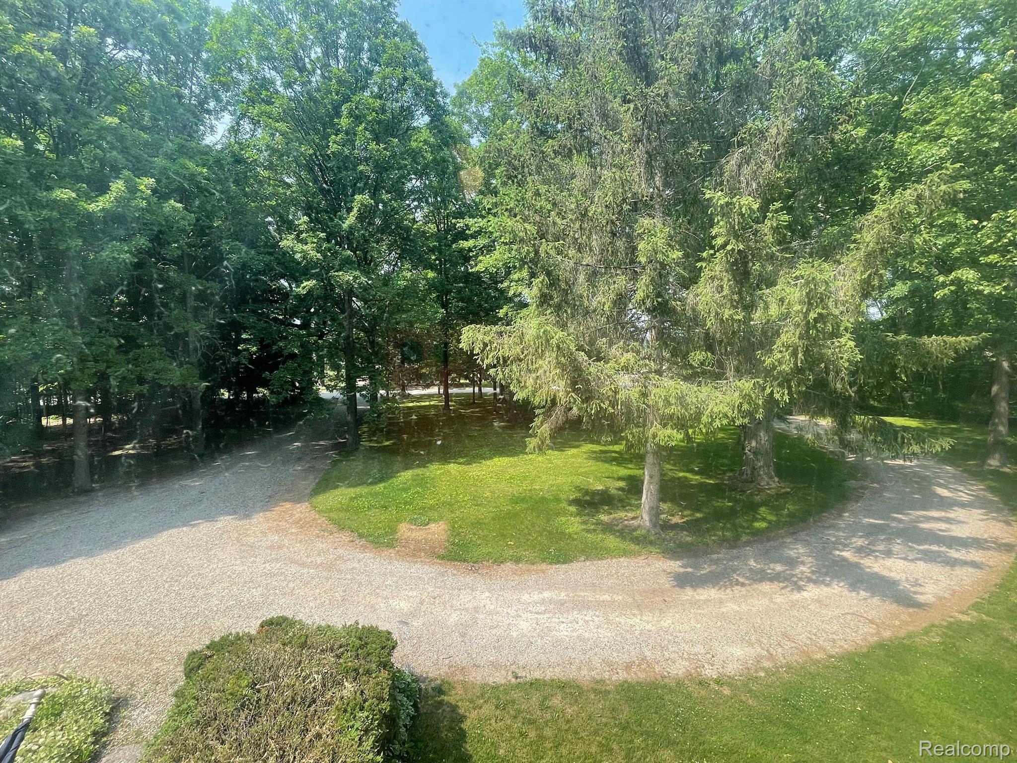 16255 Hough Road Allenton, MI 48002 - Photo 3 of 18 Summer photo of front circular driveway