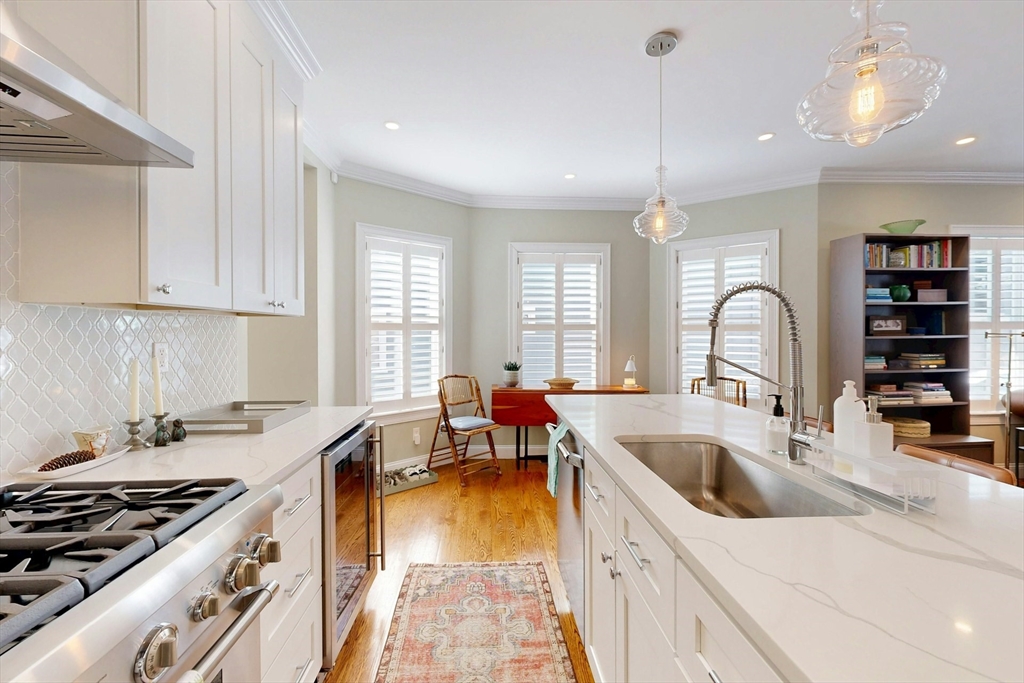 96 Floral Street, Unit 1 Newton, MA 02461 - Photo 16 of 42 a kitchen that has a sink and a stove in it