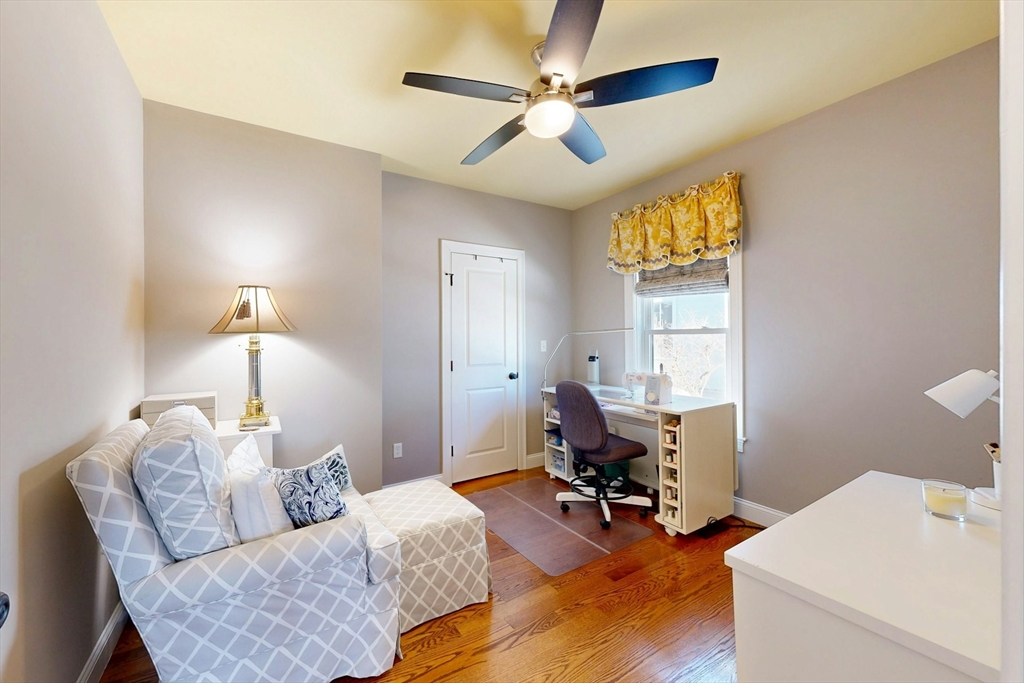 96 Floral Street, Unit 1 Newton, MA 02461 - Photo 24 of 42 a living room with furniture and a chandelier