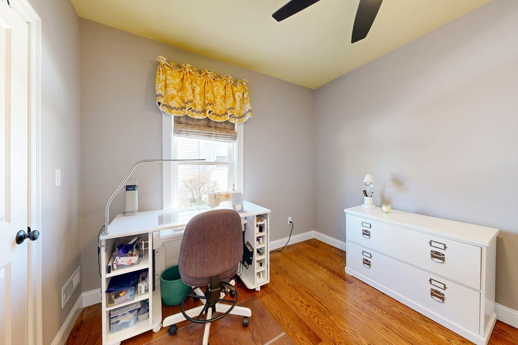 96 Floral Street, Unit 1 Newton, MA 02461 - Photo 26 of 42 a view of a workspace with furniture and a window