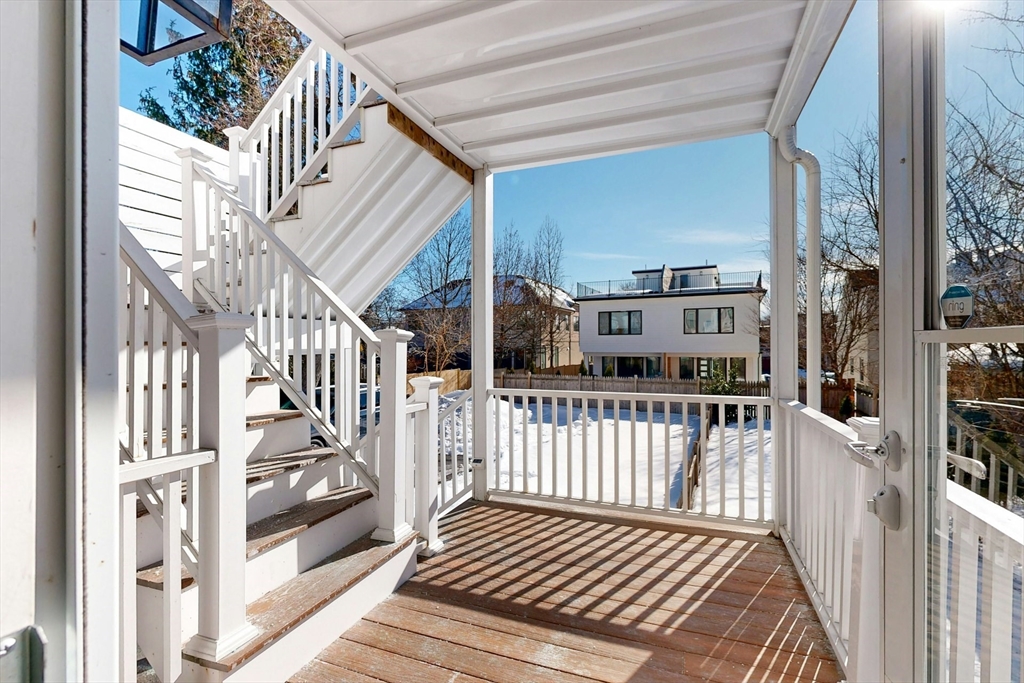 96 Floral Street, Unit 1 Newton, MA 02461 - Photo 40 of 42 a view of a balcony with wooden floor