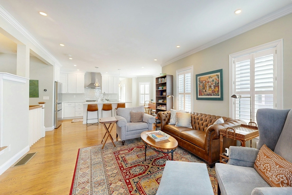 96 Floral Street, Unit 1 Newton, MA 02461 - Photo 7 of 42 a living room with furniture wooden floor and a large window