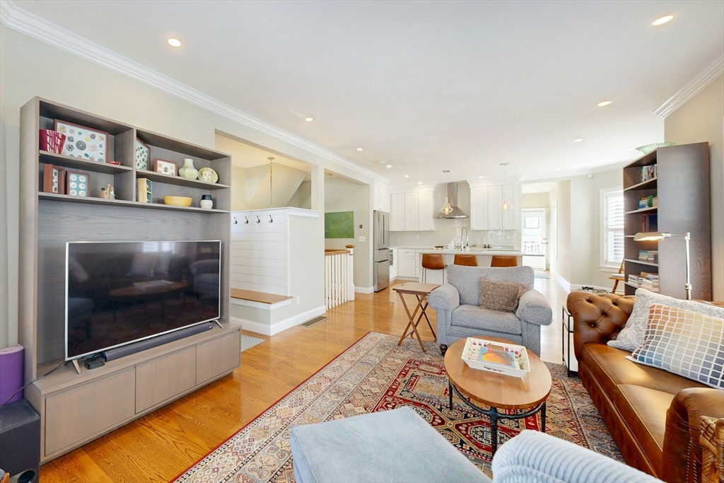 96 Floral Street, Unit 1 Newton, MA 02461 - Photo 8 of 42 a living room with furniture and a flat screen tv