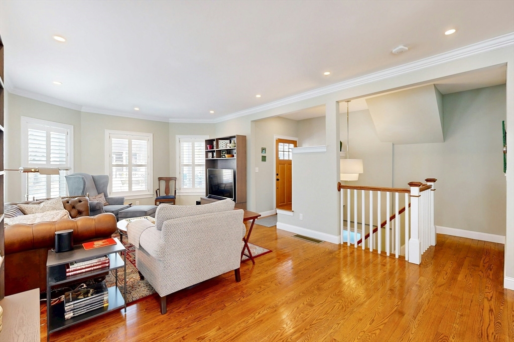96 Floral Street, Unit 1 Newton, MA 02461 - Photo 9 of 42 a living room with furniture and a wooden floor
