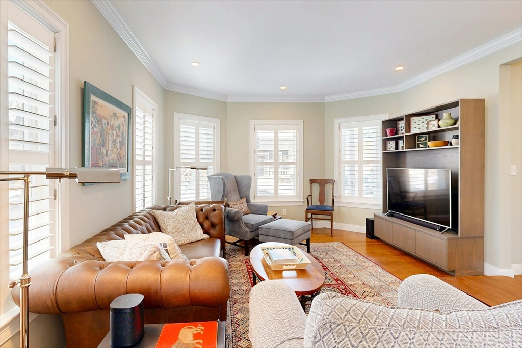 96 Floral Street, Unit 1 Newton, MA 02461 - Photo 10 of 42 a living room with furniture and a flat screen tv