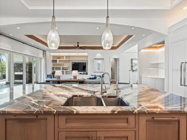 a bedroom with a bed and a ceiling fan