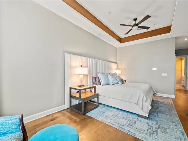 a living room with furniture and floor to ceiling windows