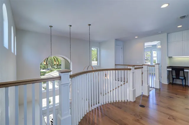 an aerial view of lake and residential houses with outdoor space
