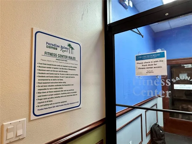 a view of a swimming pool with chairs