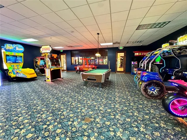 a view of a patio with a table and chairs