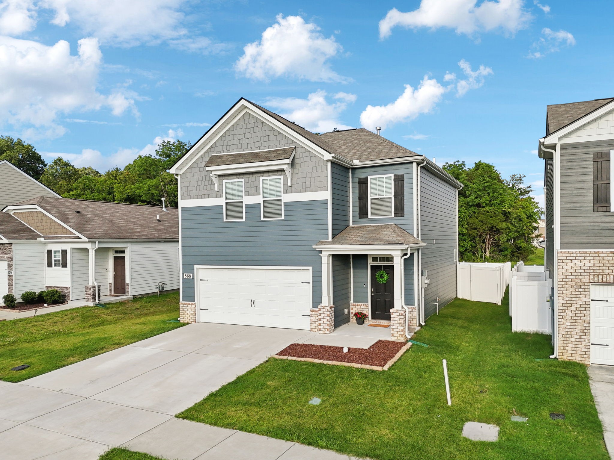 a front view of a house with a yard