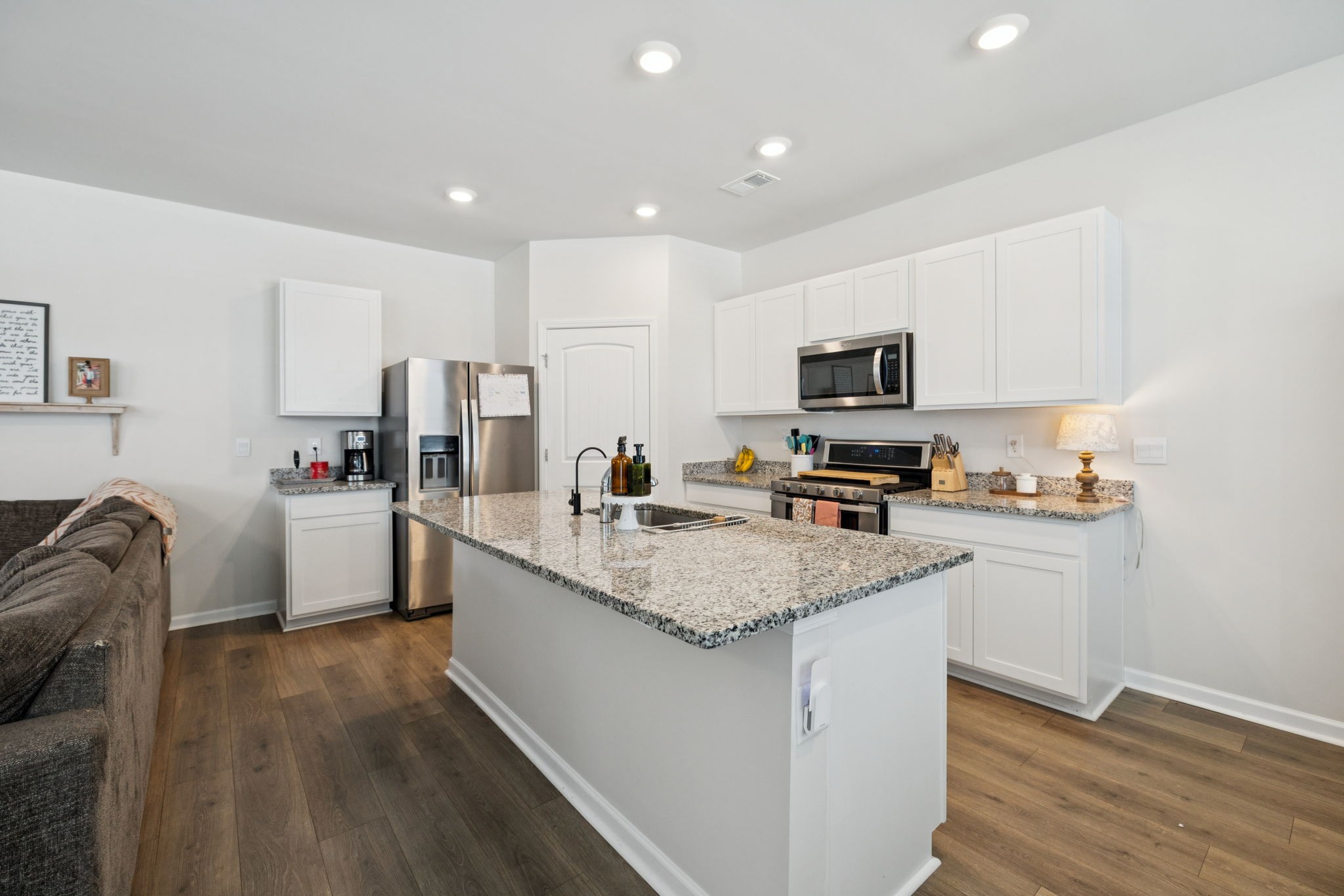 868 Long Leaf Road Lebanon, TN 37087 - Photo 11 of 40 a kitchen with granite countertop a sink stove and refrigerator