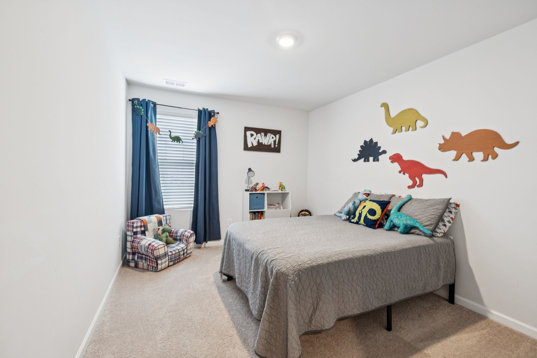 868 Long Leaf Road Lebanon, TN 37087 - Photo 20 of 40 a bedroom with a bed a couch and painting on the wall