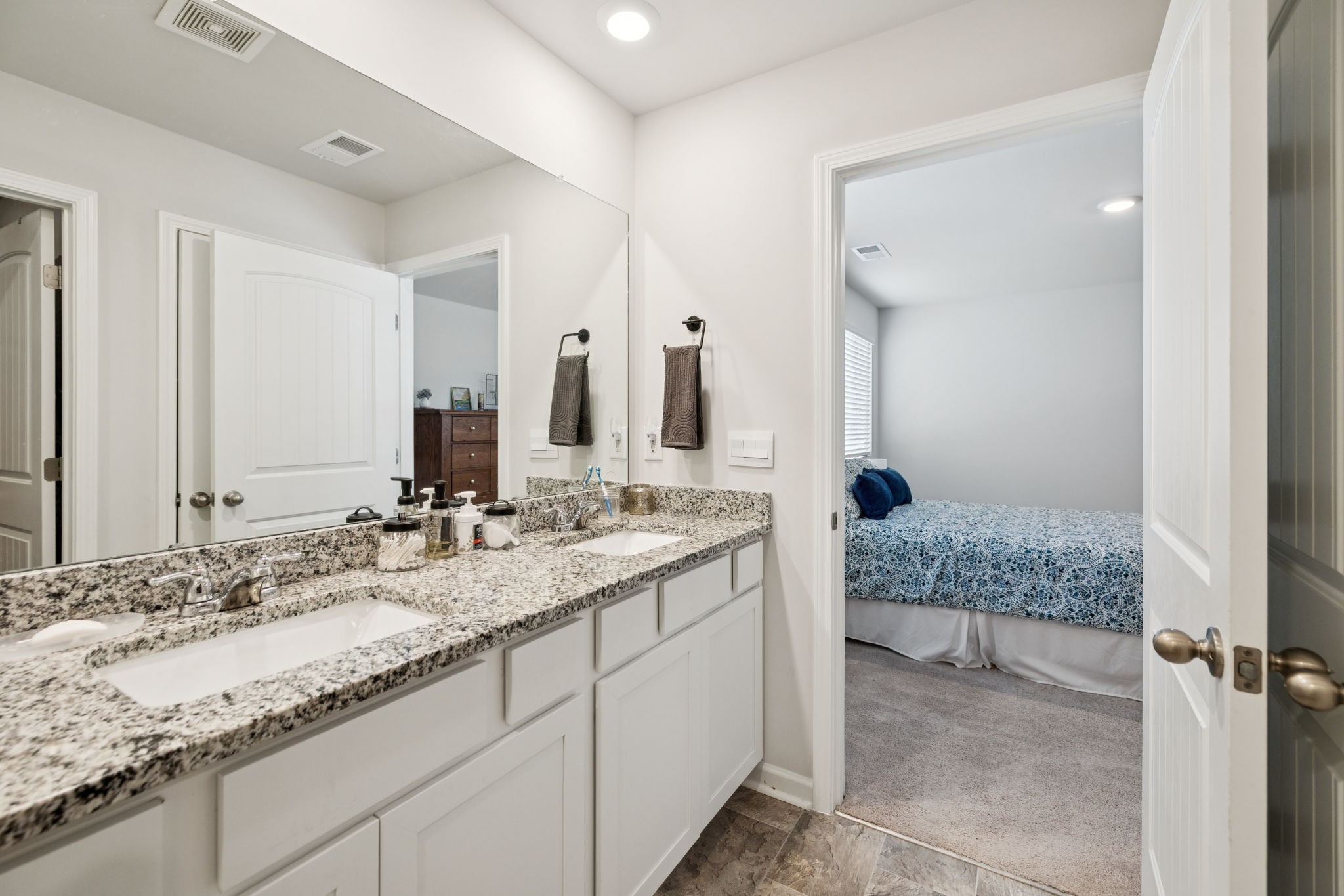 868 Long Leaf Road Lebanon, TN 37087 - Photo 23 of 40 a bathroom with a granite countertop sink and a mirror