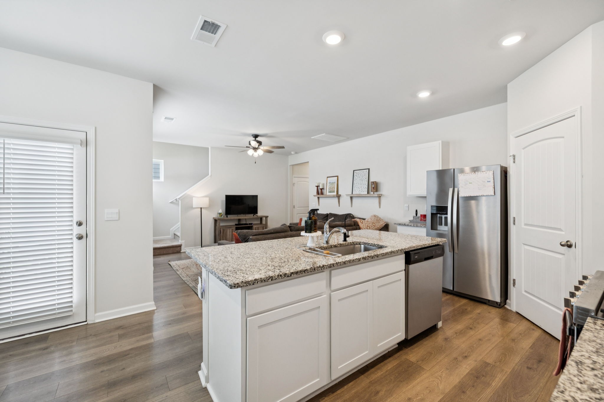 868 Long Leaf Road Lebanon, TN 37087 - Photo 9 of 40 a kitchen with stainless steel appliances granite countertop a sink stove and refrigerator