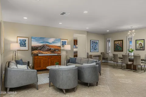 a kitchen with large windows and a table