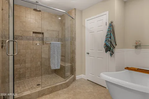 a bathroom with double sink and a mirror