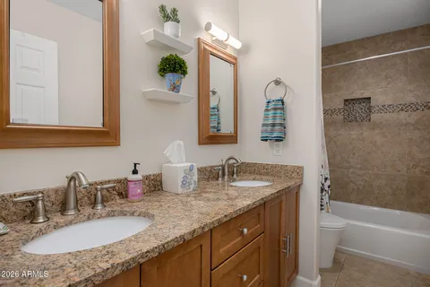 a bathroom with a bathtub and shower