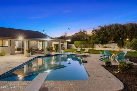 a living room with furniture and flowers