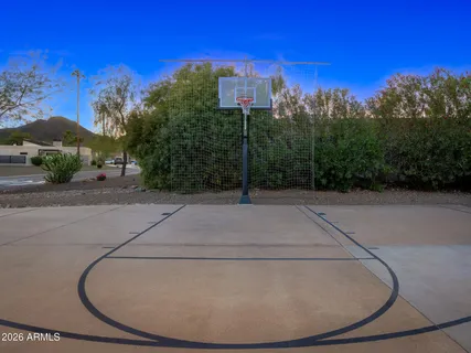 a view of a swimming pool with lounge chairs