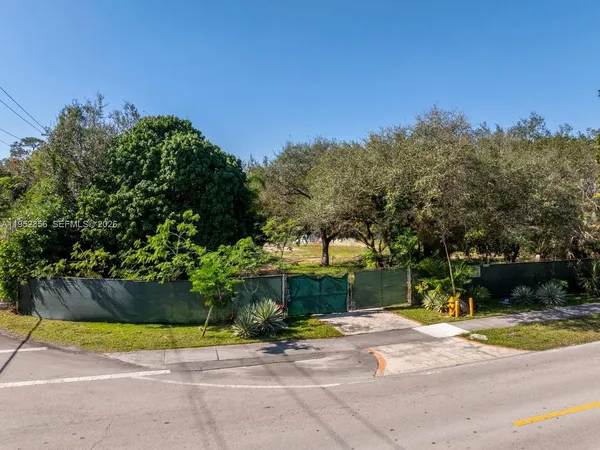 an aerial view of house with yard and outdoor seating