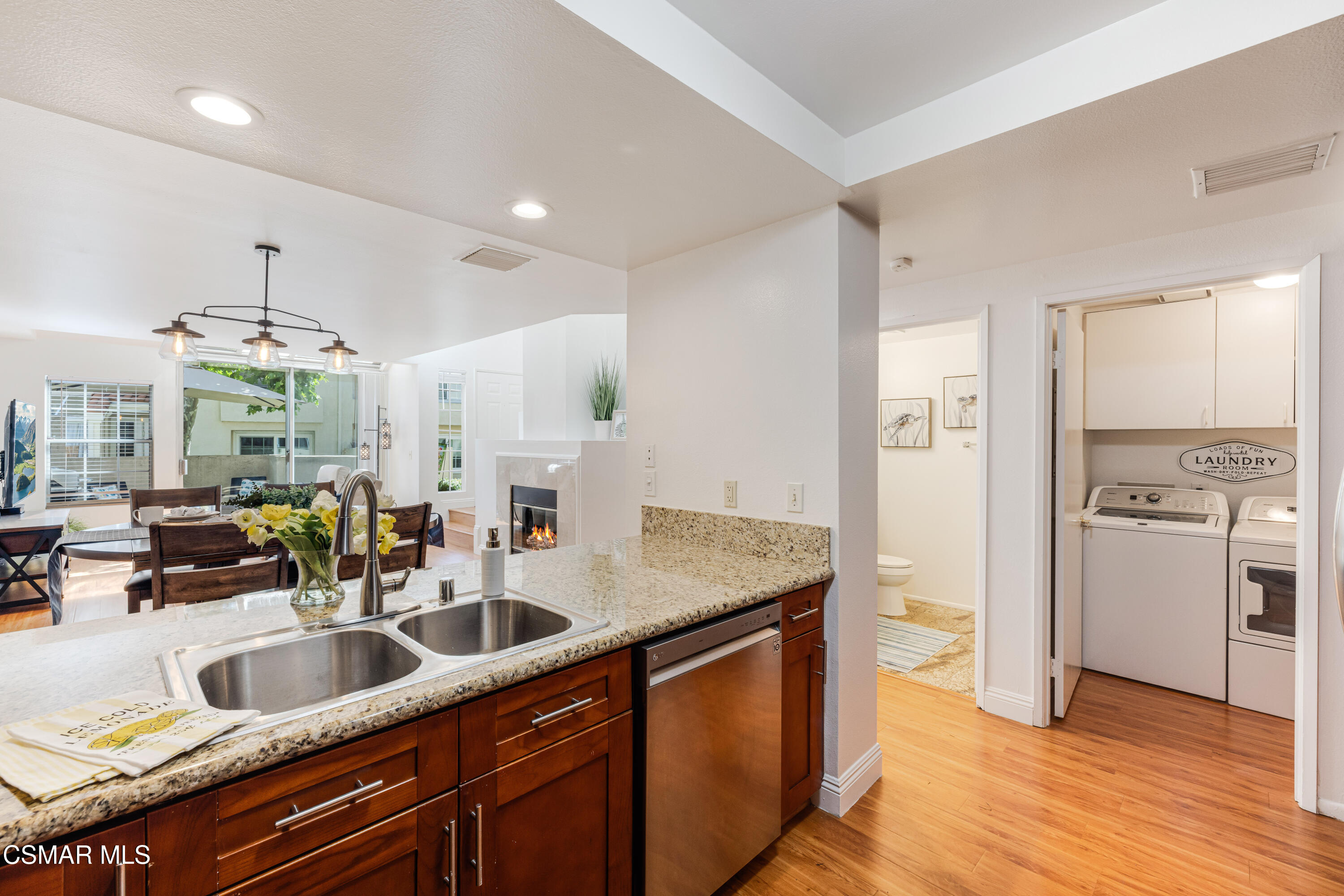 4240 Lost Hills Road, Unit 1902 Calabasas, CA 91301 - Photo 13 of 37 a kitchen with stainless steel appliances a sink a stove and a wooden floors