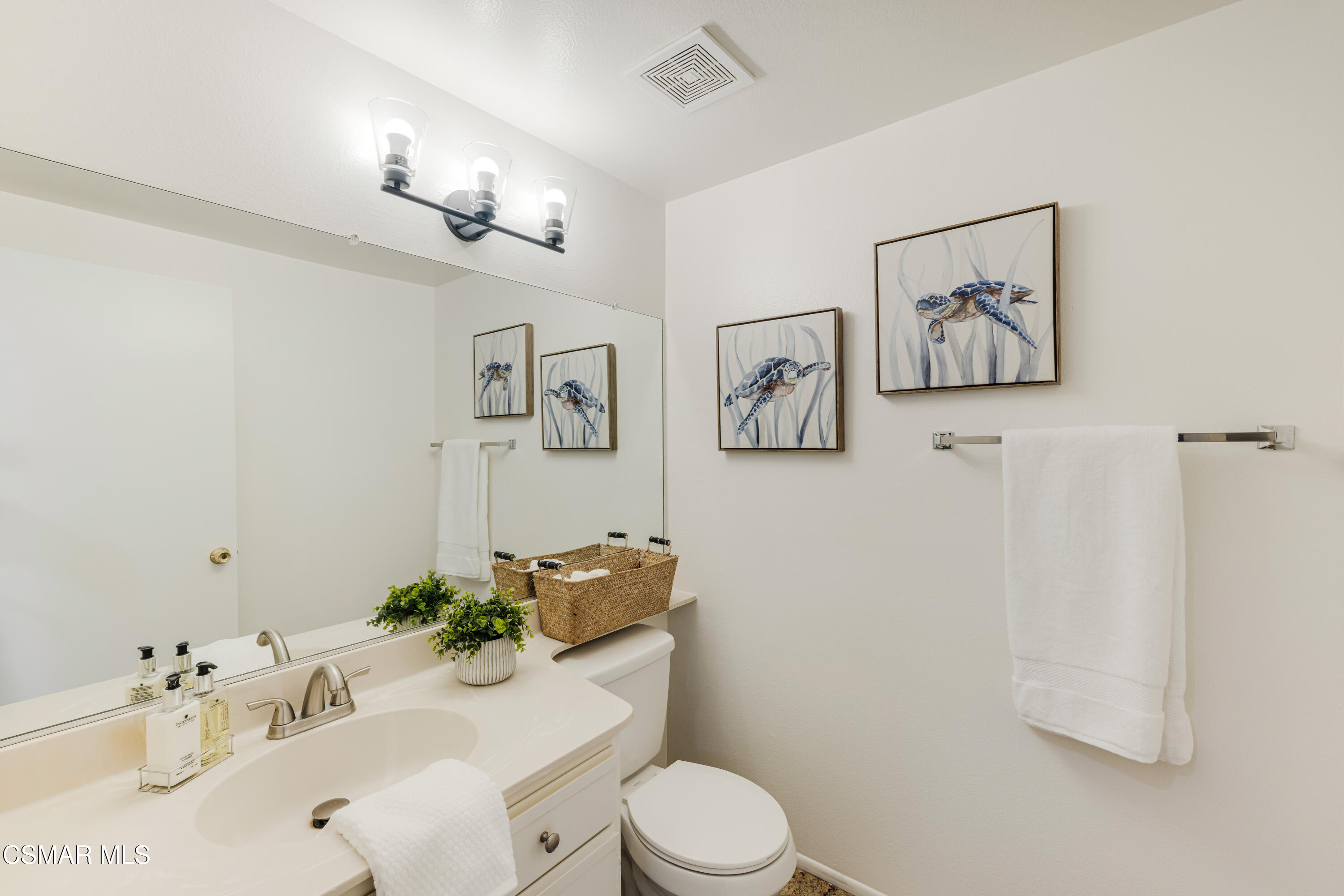 4240 Lost Hills Road, Unit 1902 Calabasas, CA 91301 - Photo 15 of 37 a bathroom with a toilet a sink and mirror
