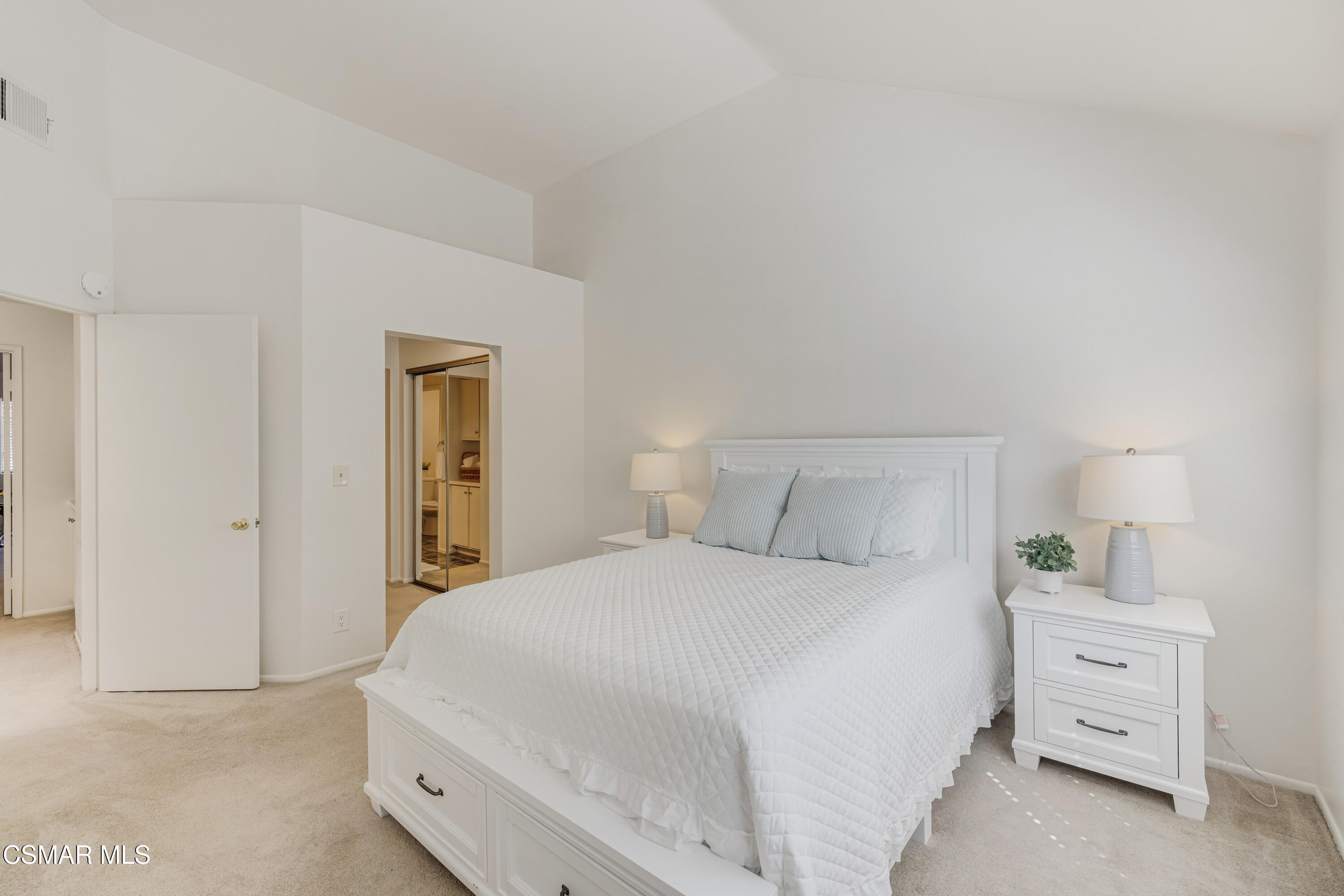 4240 Lost Hills Road, Unit 1902 Calabasas, CA 91301 - Photo 19 of 37 a bedroom with a bed and a night stand