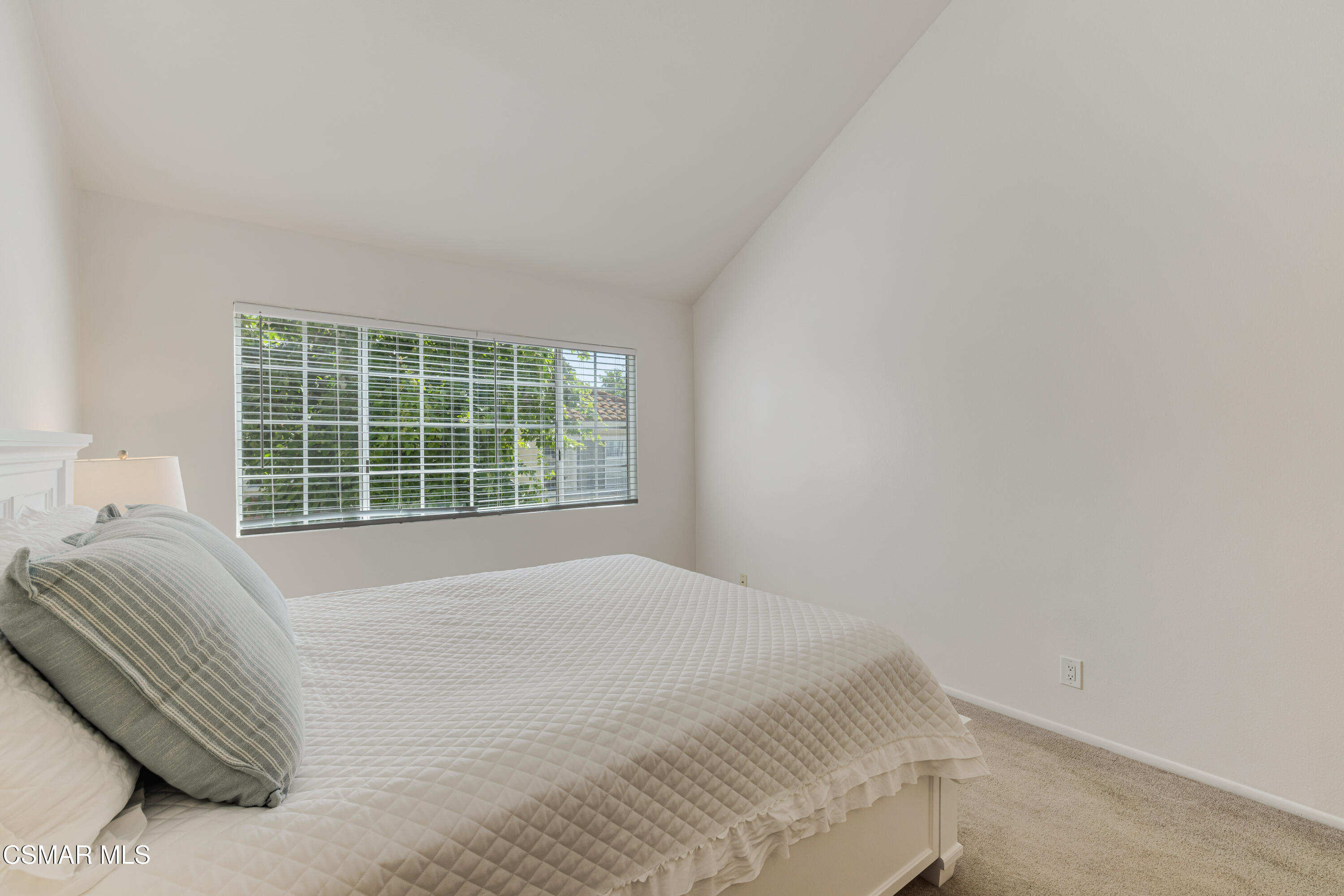 4240 Lost Hills Road, Unit 1902 Calabasas, CA 91301 - Photo 20 of 37 a bedroom with a bed and a window