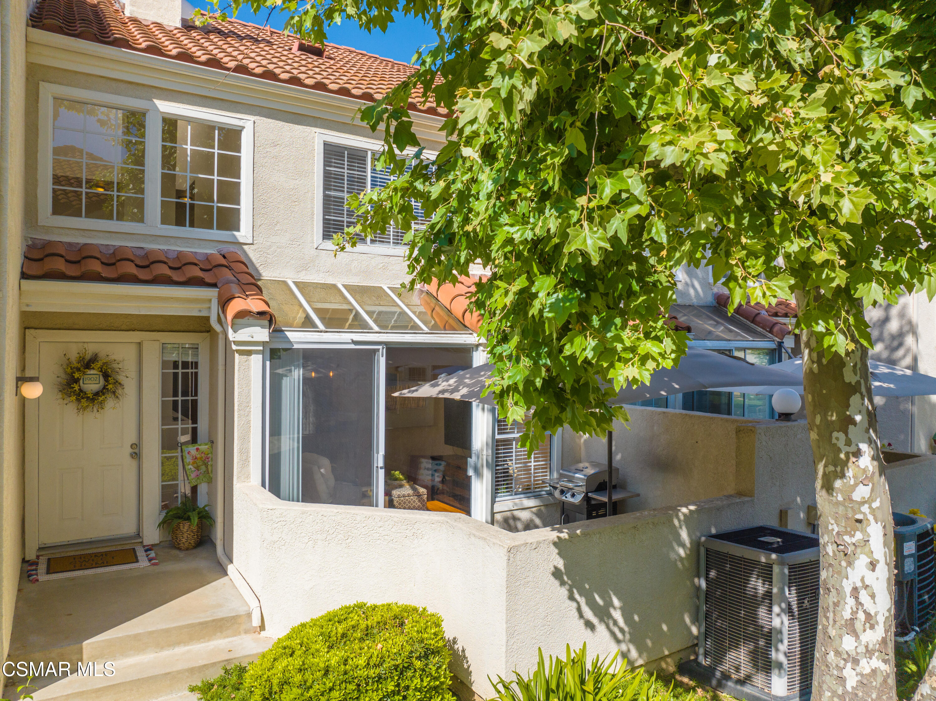 4240 Lost Hills Road, Unit 1902 Calabasas, CA 91301 - Photo 2 of 37 front view of house with a tree