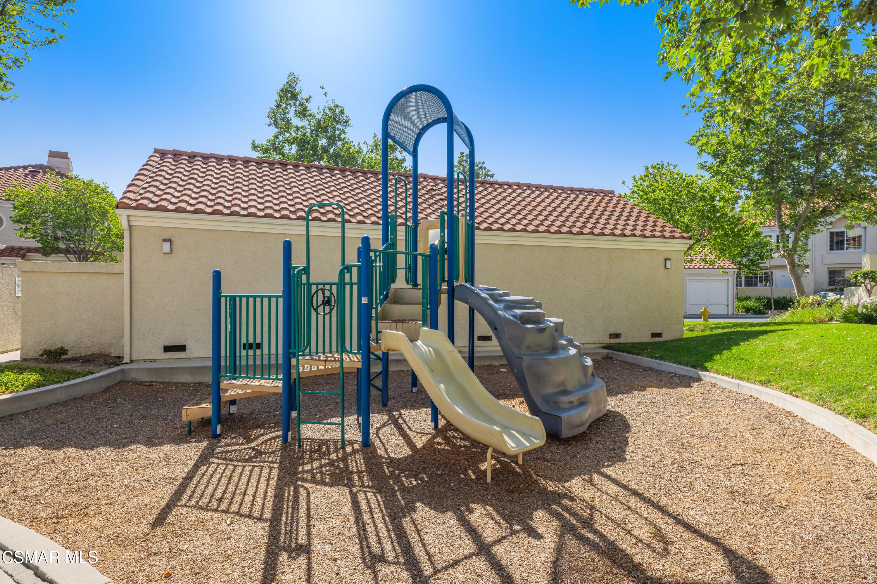 4240 Lost Hills Road, Unit 1902 Calabasas, CA 91301 - Photo 31 of 37 a front view of a house with garden