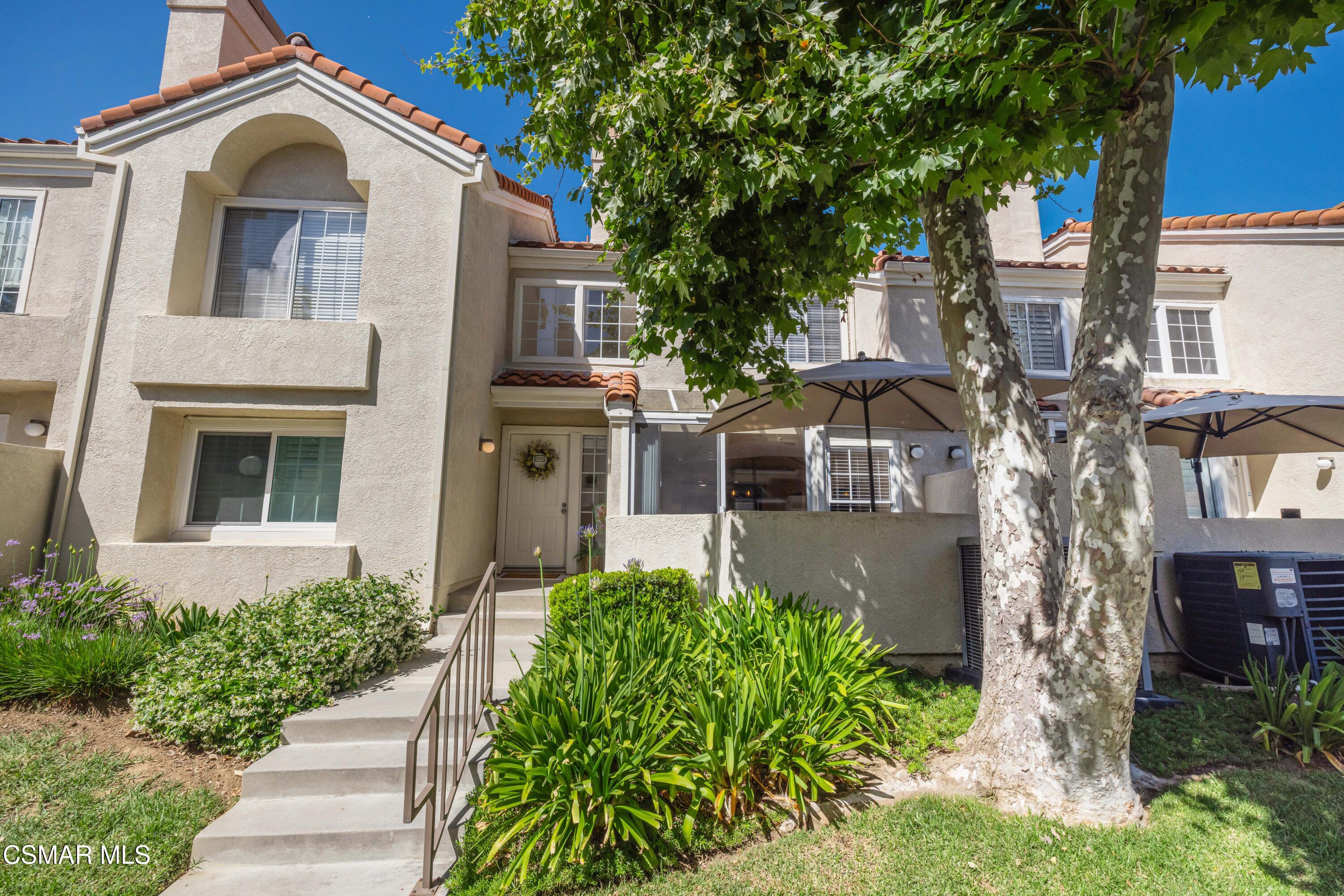 4240 Lost Hills Road, Unit 1902 Calabasas, CA 91301 - Photo 37 of 37 a front view of a house with a yard