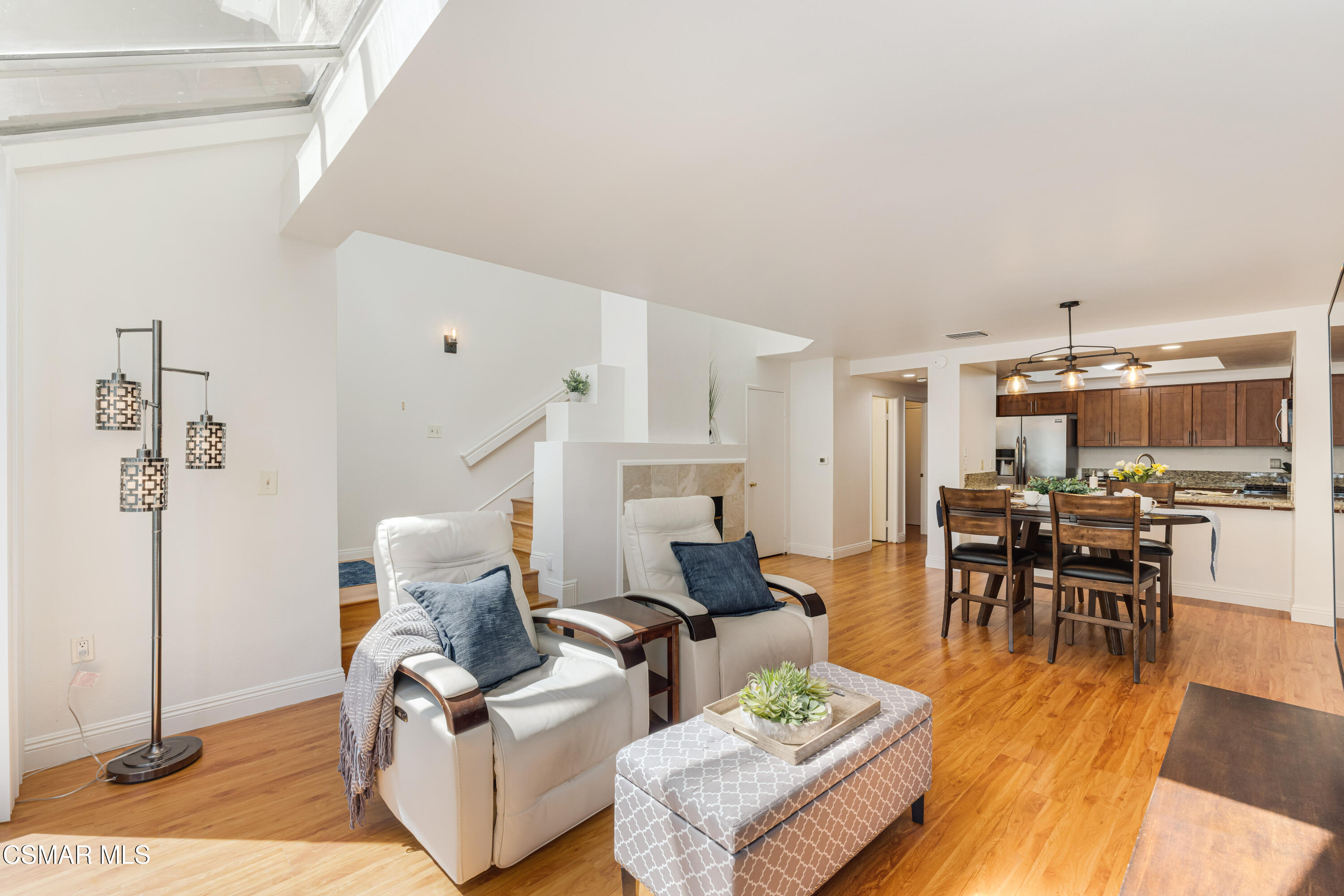 4240 Lost Hills Road, Unit 1902 Calabasas, CA 91301 - Photo 6 of 37 a living room with furniture and a dining table with kitchen view