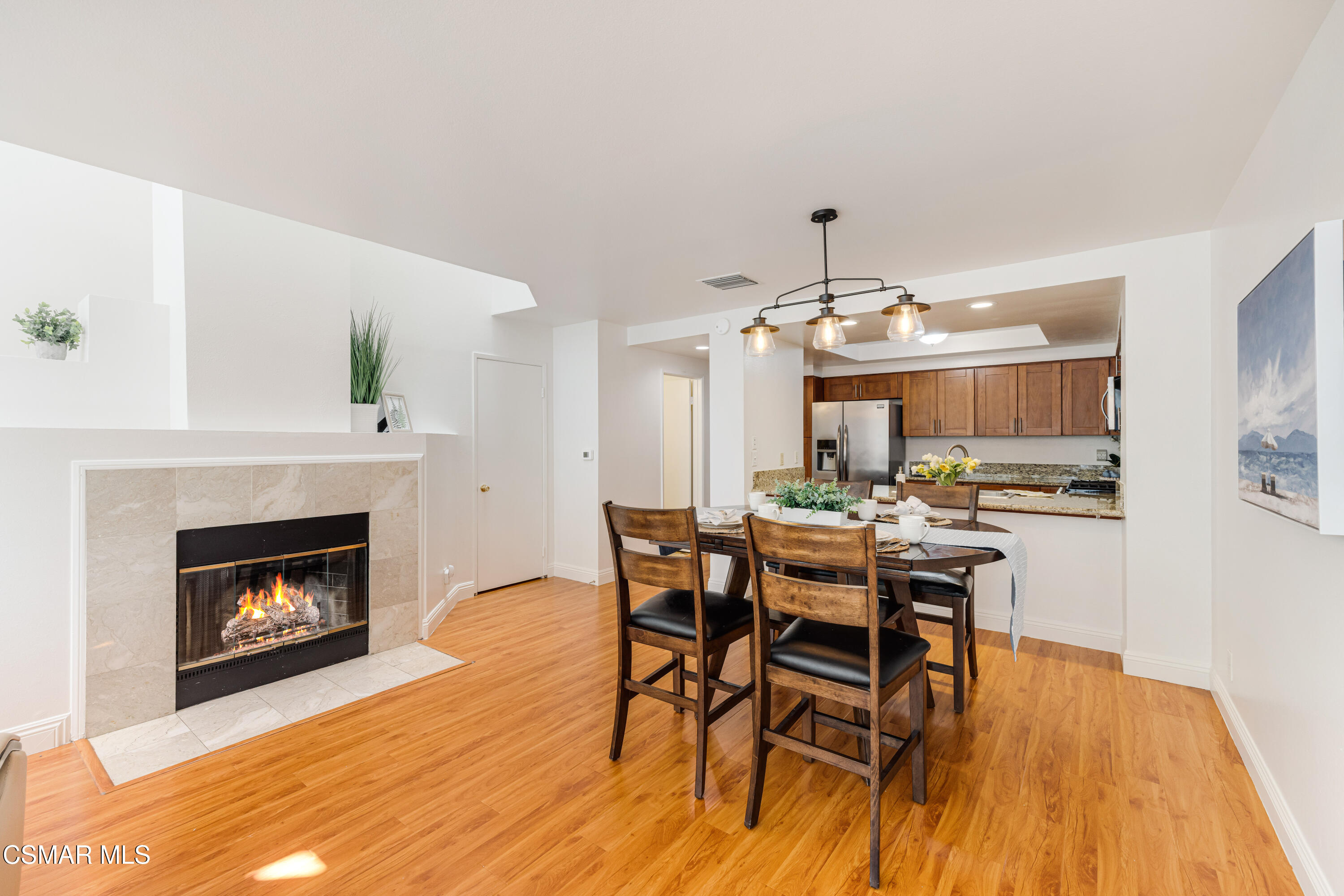 4240 Lost Hills Road, Unit 1902 Calabasas, CA 91301 - Photo 8 of 37 a view of a dining room with furniture and wooden floor
