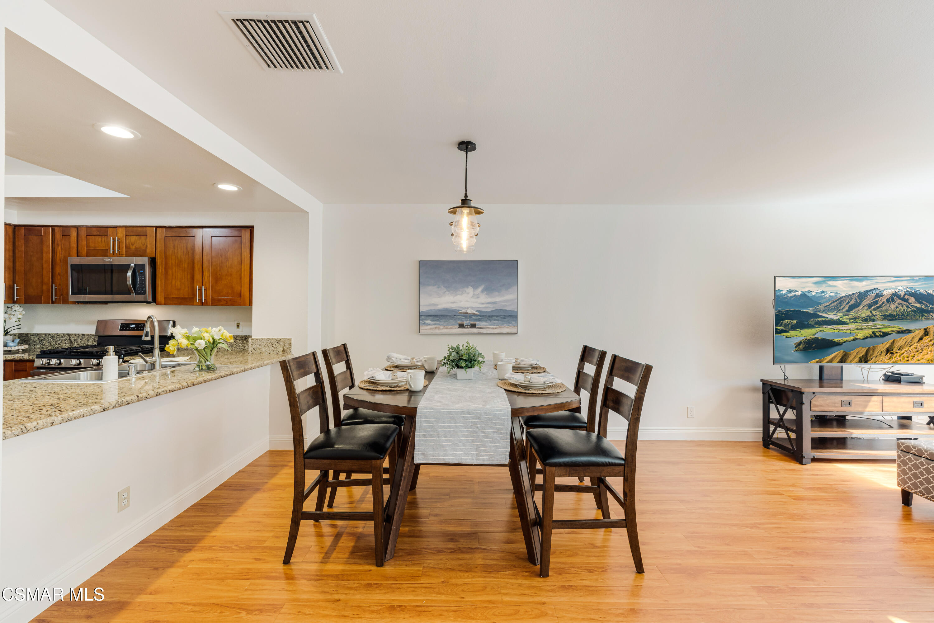 4240 Lost Hills Road, Unit 1902 Calabasas, CA 91301 - Photo 9 of 37 a view of a dining room with furniture and wooden floor